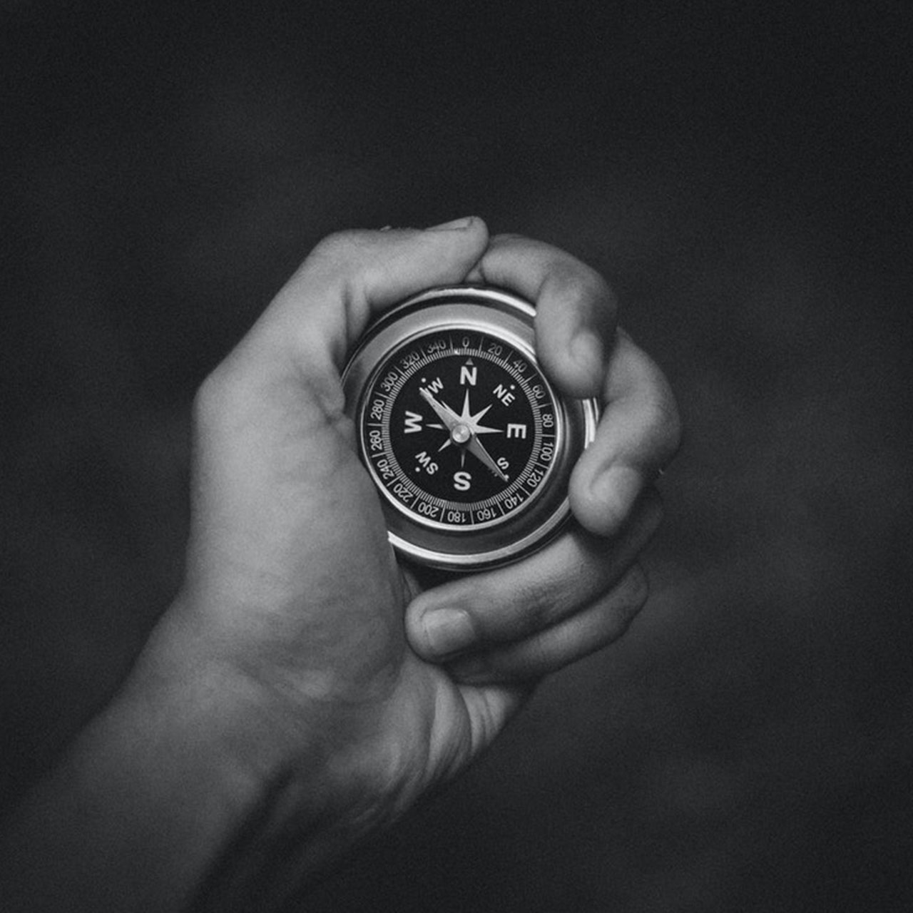 person-holding-a-compass