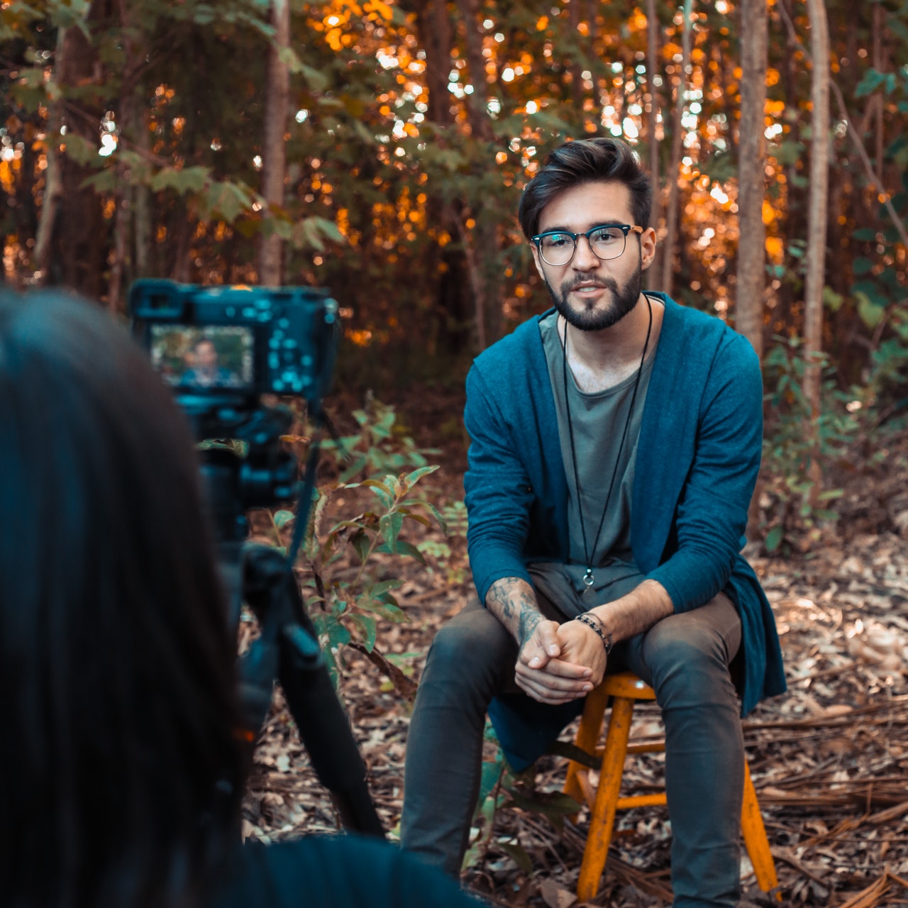 interviewing a person in front of a camera